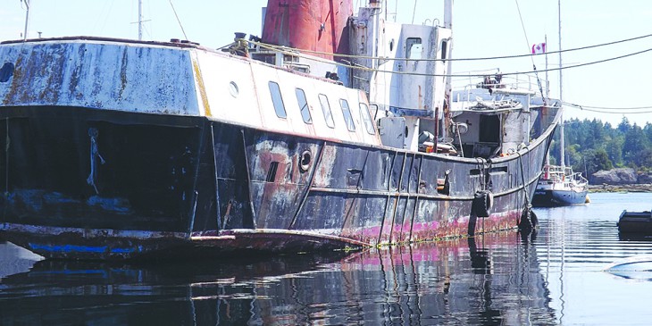 Derelict vessel finally leaving harbour